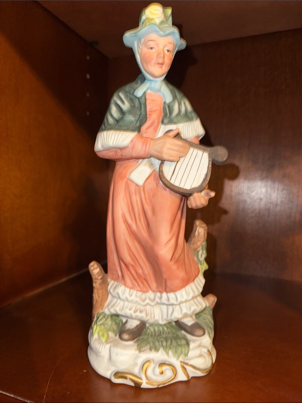 Home Interiors Porcelain Elderly Woman Figurine playing a harp.